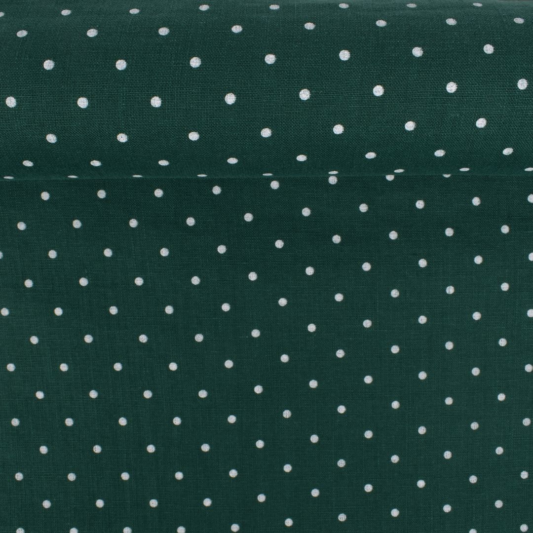 Washed linen fabric in green color with white dots, 205 g/m²